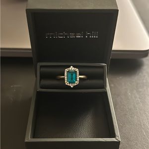 10K gold ring with diamond halo and emerald in centre - size 6 - brand new